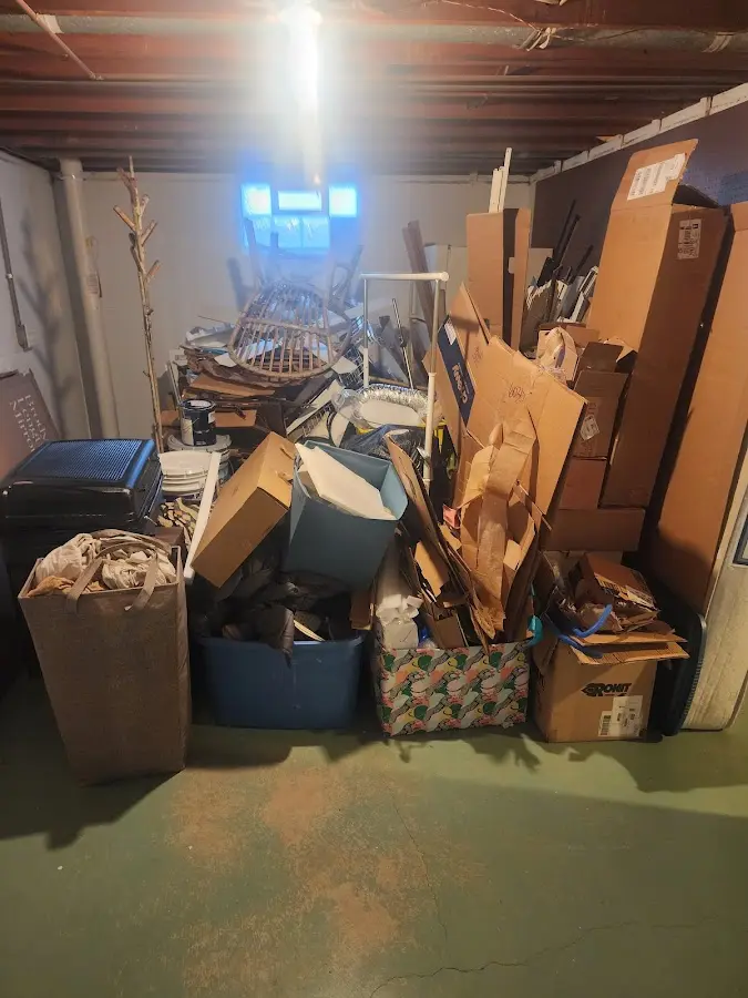 Roll-off dumpster container at job site for Yard Waste Dumpster Rental in Charlestown